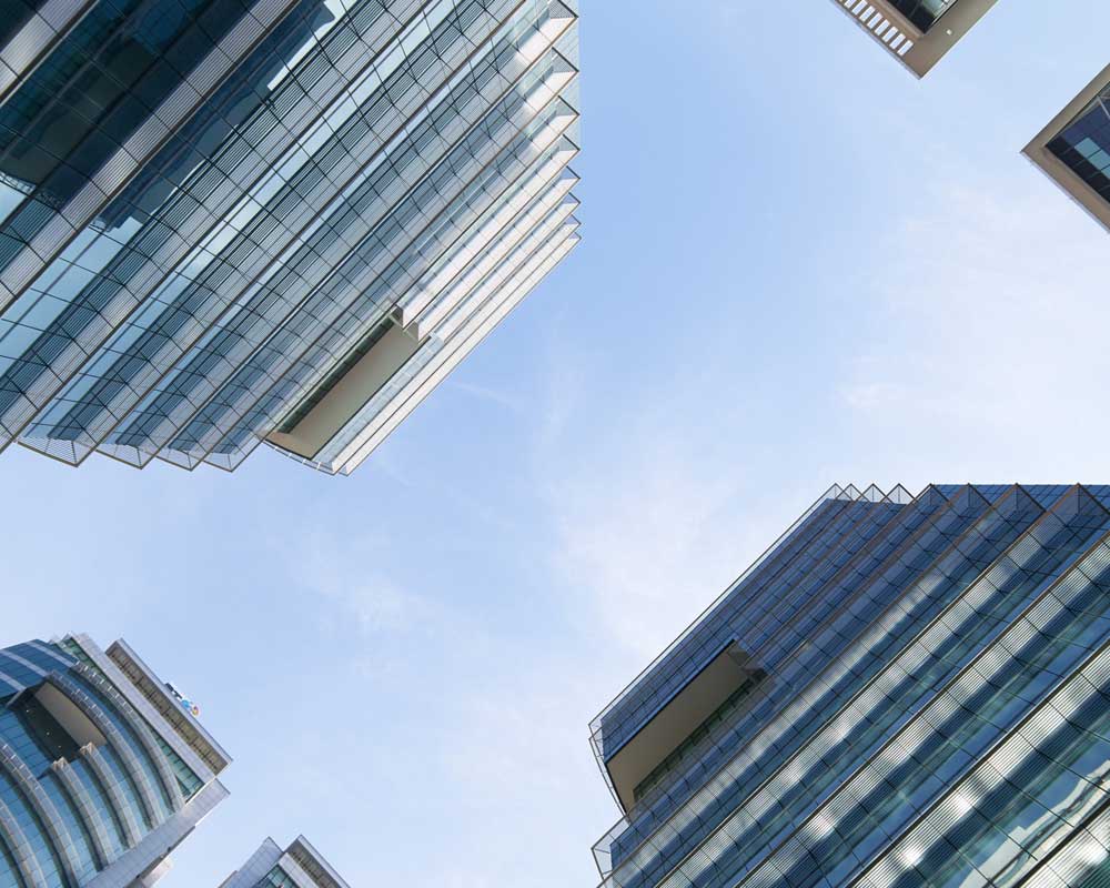 LondonElectrical.com - Image of office blocks looking towards the sky