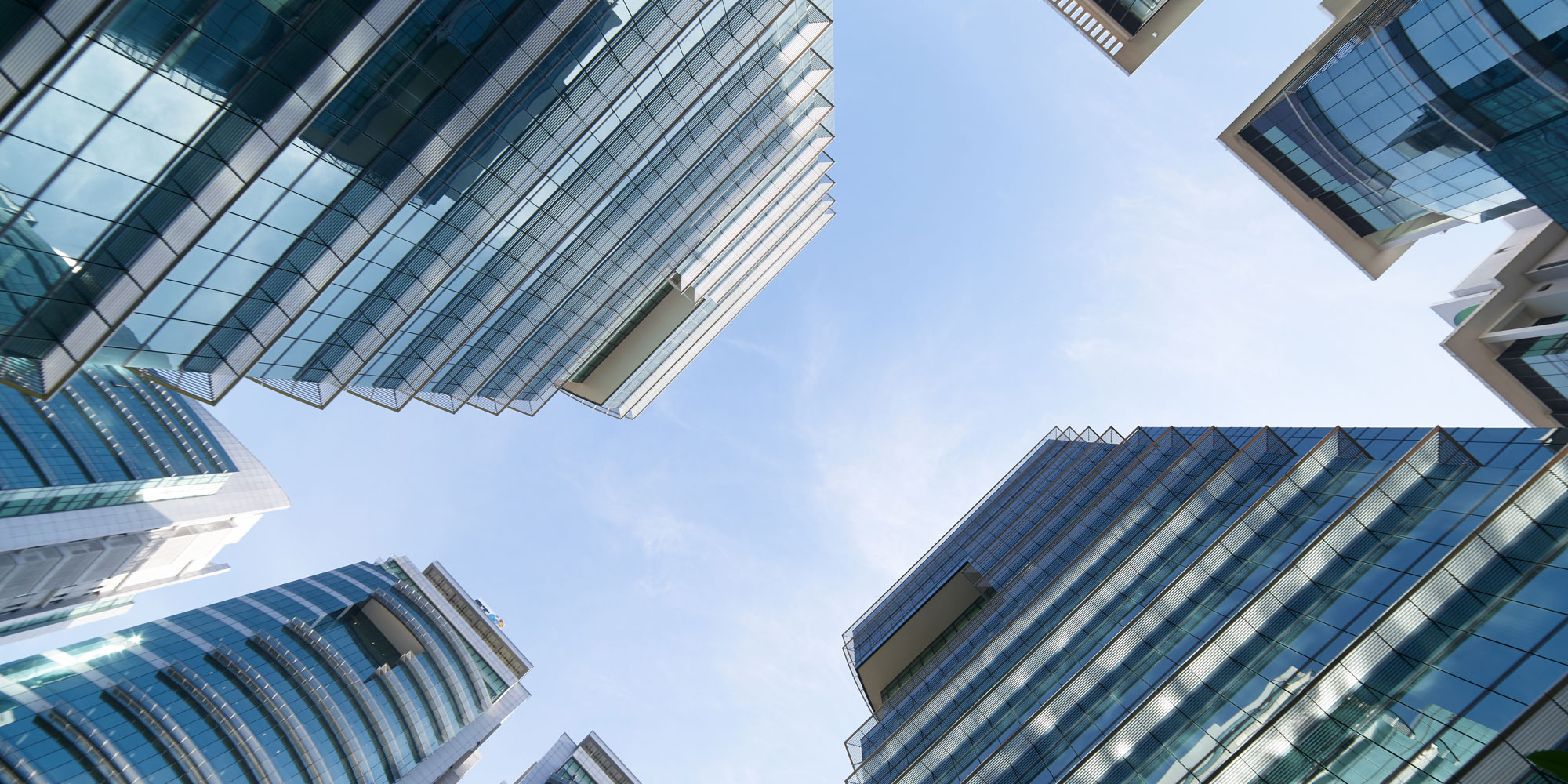 LondonElectrical.com - Image of office blocks looking towards the sky